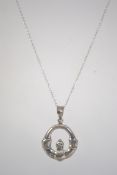 A silver necklace chain and pendant in t
