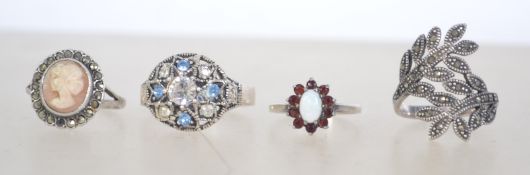 A group of 4 silver 925 dress rings to i