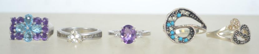 A group of 5 silver 925 dress rings to i