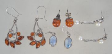4 pairs of silver 925 earrings two amber