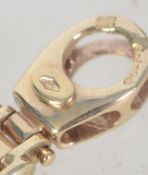 A hallmarked 9ct gold ladies designer bracelet with twin claw clasp. Hallmarked Sheffield.