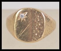 A hallmarked 9ct gold and diamond signet ring. Size P.5. Weight 5.8g. Hallmarked for Birmingham.
