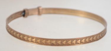 A vintage gold filled bangle with chevron pattern design. Marked gold filled with J.S.