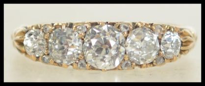 A hallmarked 18ct gold Victorian 5 stone diamond ring set with 5 old cut diamonds of approx 1.2cts.