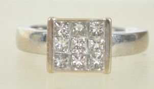 A hallmarked 18ct white gold and diamond cluster and pave set ring, inset 9 stones total half carat.