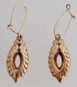 A pair of 9ct gold drop earrings. Hallmarks worn. Tests 9ct gold..