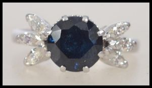 A ladies platinum sapphire and diamond ring.