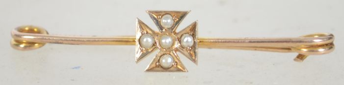 A early 20th century 9ct gold and seed pearl bar brooch pin with Maltese cross emblem set with seed