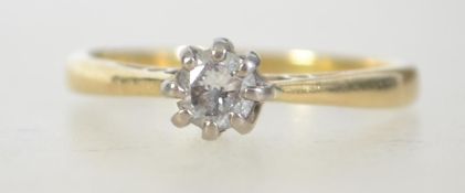 An 18ct gold and diamond solitaire ring, Diamond stamp 25pts being claw mounted. Makers AT Ltd.