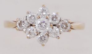 A 9ct gold ring set with a CZ cluster. Hallmarked 9ct gold Size P.5.