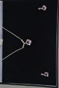 A hallmarked 9ct white and yellow gold diamond and amethyst necklace and earring suit.