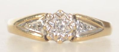 A vintage 9ct gold and diamond ring with central star set diamond with diamond set shoulders.