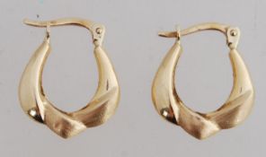 A pair of 14ct gold creole earrings with leaver catch. Marked ARR 14K. tests 14ct gold. Weight 1.3g.