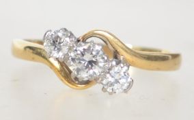 An 18ct gold and Platinum diamond trilogy ring set with three good diamonds a total of approx 60pts.