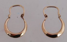 A 9ct gold trilogy ring set with a CZ with a central cornflower blue gem stone with an expanding