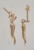 A pair of 9ct gold stud earrings in the form of horn of plenty with post backs. Marked 9ct.