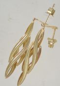 A pair of 9ct gold drop earrings with post backs. Test 9ct gold. Measure 4cms.