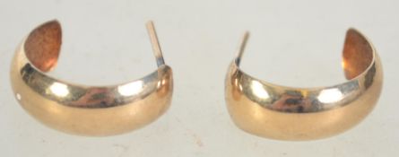 A pair of 9ct gold hoop earrings with post backs. Marked 375 to body, tests 9ct gold. Measures 1.
