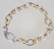 A hallmarked 9ct white and yellow gold bracelet of oval link form by Italian designer Bassi.