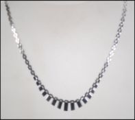 A hallmarked 9ct white gold Cleopatra link chain with twin hook clasp. Hallmarked Sheffield.