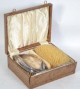 A silver hallmarked pair of clothes brushes and co