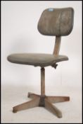 A mid century Industrial office swivel desk chair
