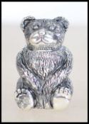 A silver plated pin cushion in the form of a teddy