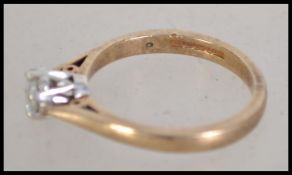 A hallmarked 9ct gold solitaire diamond ring. Diam