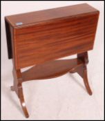 An Edwardian mahogany inlaid sutherland table. Rai