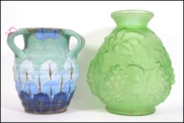 An unusual and handpainted drop glaze twin handled