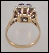 A vintage ladies 9ct gold and ruby diamond ring of