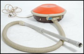 A vintage retro Hoover atomic flying saucer vacuum