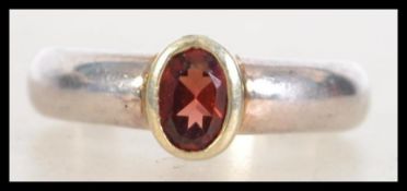A ladies silver and ruby garnet stone dress ring h
