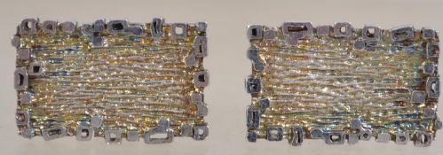 A pair of hallmarked silver modernist / brutalist  gentleman's cuff links having a textured panel