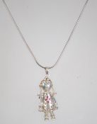 An unusual silver 925 figural pendant in the form of Goldilocks having fully articulated joints blue