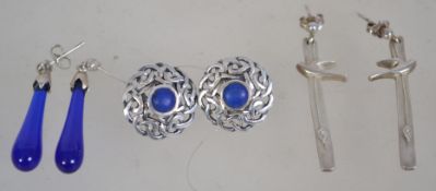 Three pairs of silver 925 earrings to include a Celtic knot shield pair with central blue stone, a