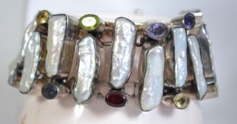 A fantastic silver 925 bracelet with baroque pearl panels and faceted coloured glass stones having a