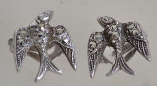 A fantastic pair of silver and marcasite Art Deco clips in the form of swallows in flight being