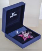 An original Swarovski crystal pink flower bud 3D brooch No. 879726. Complete in original box with