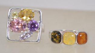 Two silver 925 ladies rings both with coloured stones one ring having the stones set within a silver