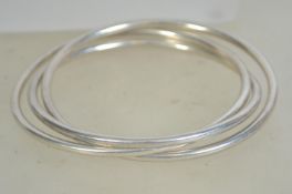 A silver 925 Tuscany stacking trilogy bracelet of simple form being marked IBB 925. Measures 3