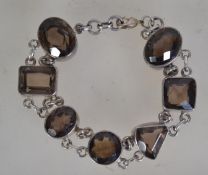 A fantastic silver 925 bracelet chain having a dual rolo link chain with large faceted citrine