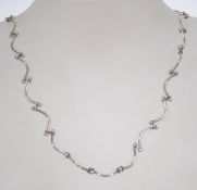 A silver 925 rib bone and ball link necklace chain having a spring hoop clasp. Chain measures 18