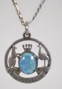 A silver fob pendant bearing the Australian coat of arms having a central opal triplet stone