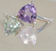 A silver 925 ladies dress ring having 3 trilliant cut coloured stones. Weighs 5.5 grams size T