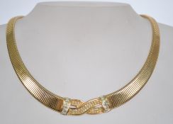 A 20th century Christian Dior Bijoux goldtone necklace set with rhinestones Marked to foldover