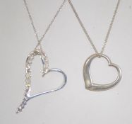 Two silver 925 necklace chains bother being curb linked with push hoop clasps. One having a heart