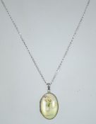 A silver 925 curb link necklace chain with spring hoop clasp having a silver 925 locket with