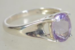 A silver 925 ladies dress ring having a central fa