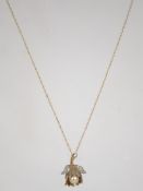 A 9ct gold fine rope twist chain with spring hoop clasp having a vintage gold plated gilt silver 925